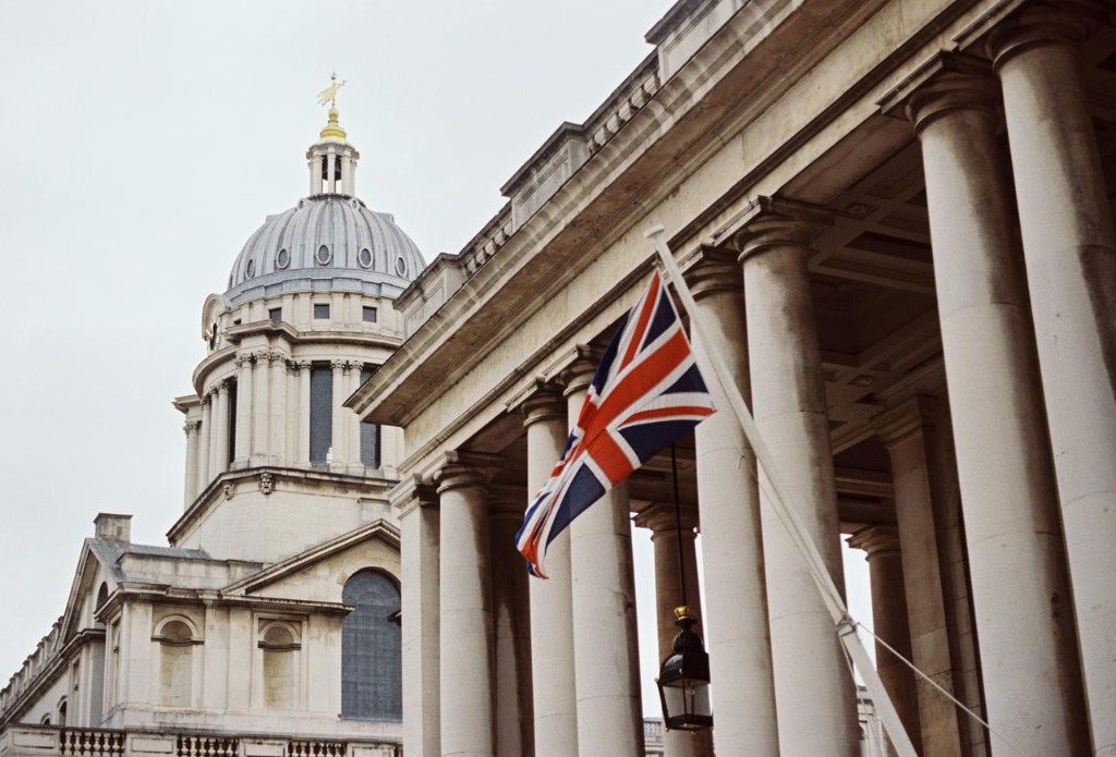 Historic UK university architecture with Union Jack flag